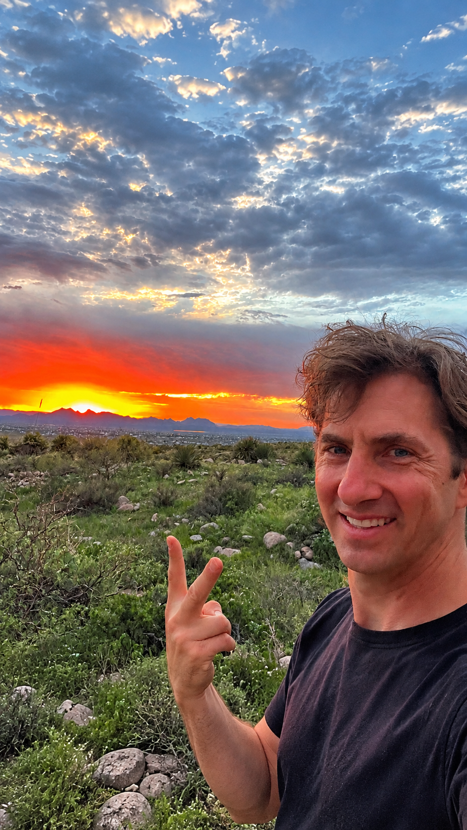 Brett Stein enjoying a dramatic desert sunset over the Organ Mountains