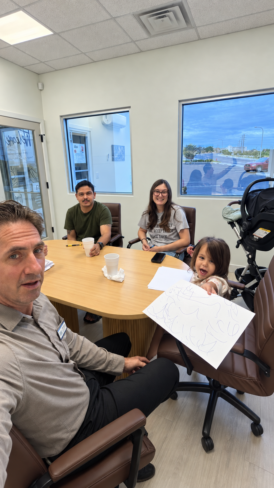 Brett Stein with a client family at a real estate meeting in Las Cruces